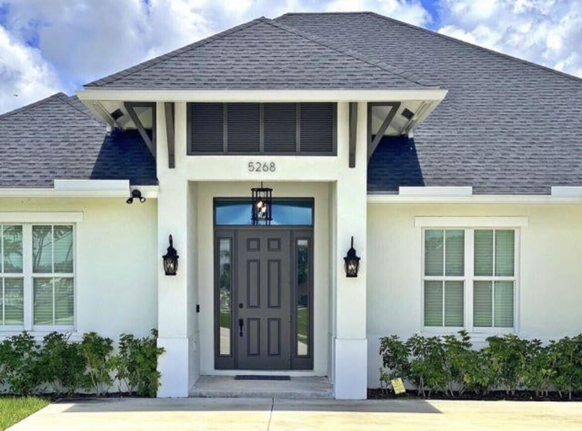 Built in 2019. 4 Bedrooms - 3 Bathrooms - 2 Car Garage and 1 Storage (Golf cart, ATV) Garage. Step inside and enjoy the light and bright interiors with spacious and open living areas, high ceilings and laminate flooring in every room. The home features shaker style solid wood cabinetry, stainless steel appliances, large island, impact windows and doors. The master suite is complete with a luxurious master bath which boasts a spa-like tub, separate shower and walk-in closet. Located next to Winterlakes Park and close to plenty of shopping, dining, Clover Park and easy access to i95. There is a lot of room to roam on this property. Recently painted. Move-in ready! No HOA