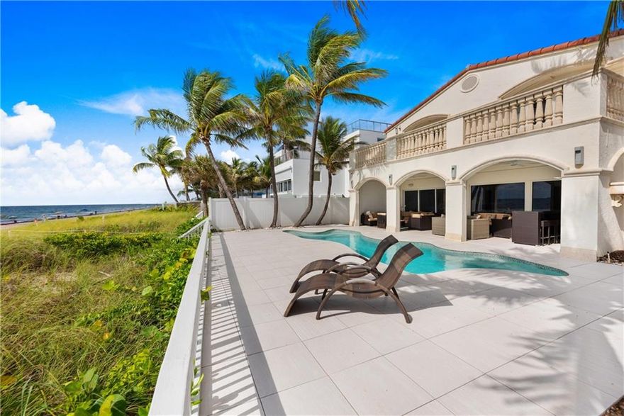 A rare opportunity to acquire a beachfront home with 50 FT +/- directly on the sand of Fort Lauderdale Beach. This lovely, beachfront gated residence is a 4BR | 4BATH with 4102 SqFT LA, with gorgeous ocean views from the formal living room, bar, dining room and master bedroom.  Enjoy lounging oceanfront in the heated, salt chlorinated pool, under the covered patio or from the master bedroom balcony. The oversized master bedroom features a sitting area, walk-in closet and large master bathroom. Additional bedrooms are en-suite. This residence has an automatic gated entrance, garage, full house generator, wine cooler, and newer roof.