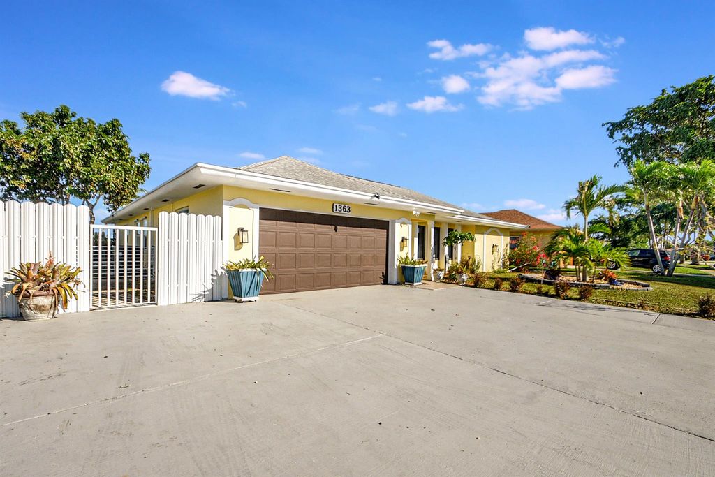 Photo of 1363 N Mangonia Drive, West Palm Beach, FL 33401 (MLS # R10948166)