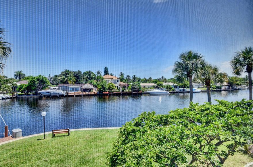 Wake up to stunning sunrises over the Hillsboro River in this exceptional 2BR/2BA waterfront retreat at Boca Bayou! Located in the premier building with captivating wide water views, this condo offers the ultimate waterfront lifestyle—watch the daily boat parade from your spacious master suite or updated open-concept living area. Impact windows provide peace of mind. The modern kitchen flows seamlessly into dining and living spaces, perfect for entertaining or relaxing evenings. Added bonus: in-unit washer/dryer for your convenience! Resort-style amenities include 5 pools, clubhouse, tennis courts, and 24-hour gated security. Rent covers cable with HBO, water, sewer, and trash. Minutes to pristine beaches, Mizner Park shopping & dining, Royal Palm Plaza, and downtown Boca's vibrant scene.