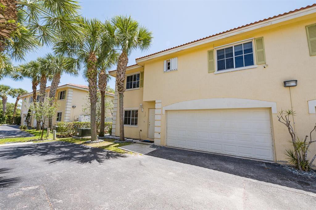 Don't miss this rare opportunity! This fully renovated townhome features a spacious two-car garage and a private fenced yard, perfect for entertaining. Located just an 8-minute drive from Deerfield Beach and within walking distance of shopping, dining, and entertainment. Plus, it's only a 2-minute drive to Pioneer Park, which offers a public boat ramp—ideal for boating enthusiasts! The oversized garage easily accommodates a jet ski or a boat up to 19 feet. A true boater’s dream!