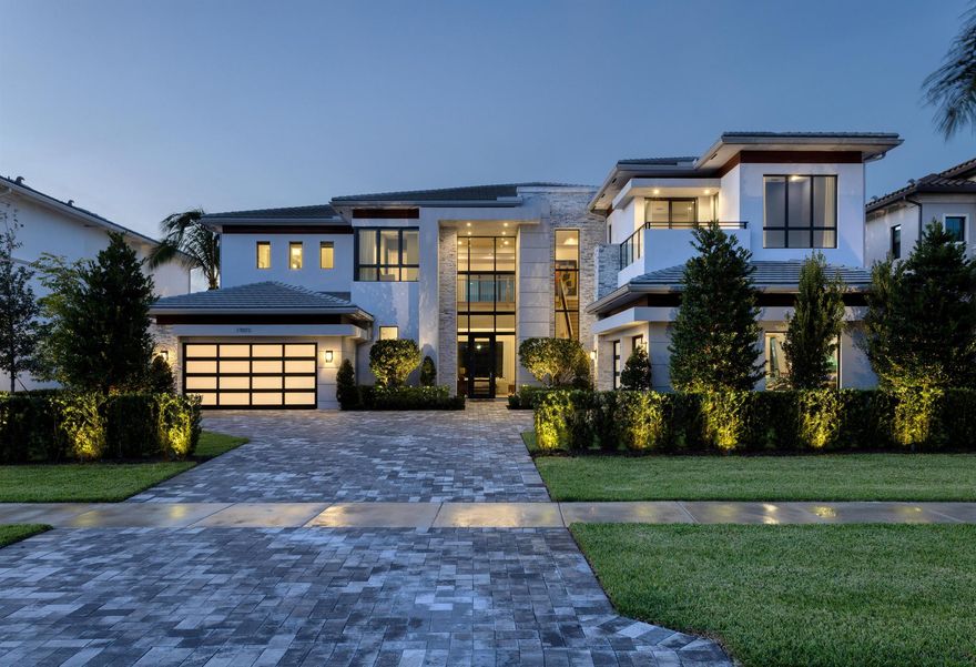 This Vanderbilt Grand model, the largest offered in Boca Bridges, was constructed by the illustrious GL Homes in 2022. With 8,101+/- square feet of luxurious living space, this majestic residence boasts six spacious bedrooms, eight bathrooms, four-car garage, custom and upgraded accents, luxurious millwork, resort-style pool, and opulent outdoor living area. A fully furnished option is negotiable for this sprawling estate.