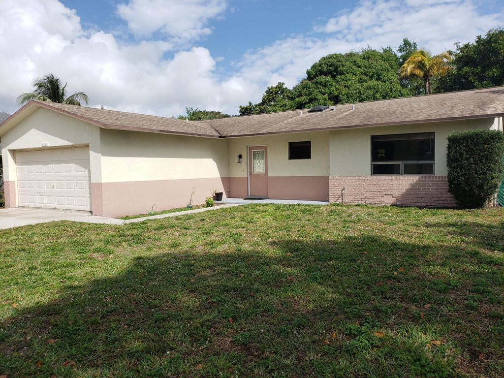 Photo of 1311 N Mangonia Drive, West Palm Beach, FL 33401 (MLS # R10959427)