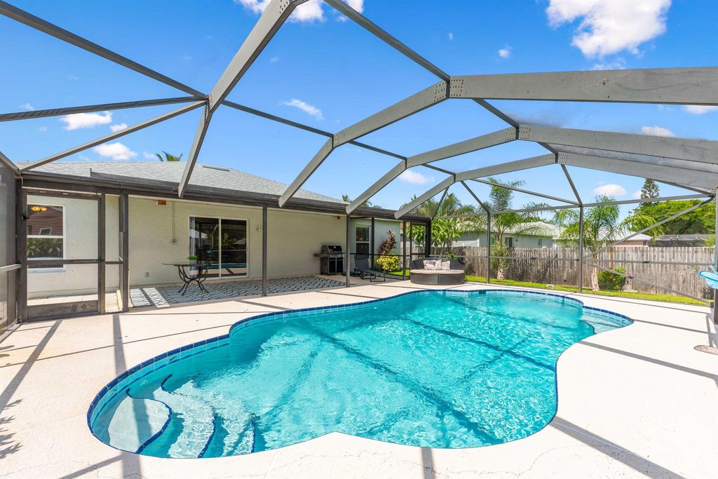 Photo of 1417 SW Flounder Lane, Port Saint Lucie, FL 34953 (MLS # R11008695)