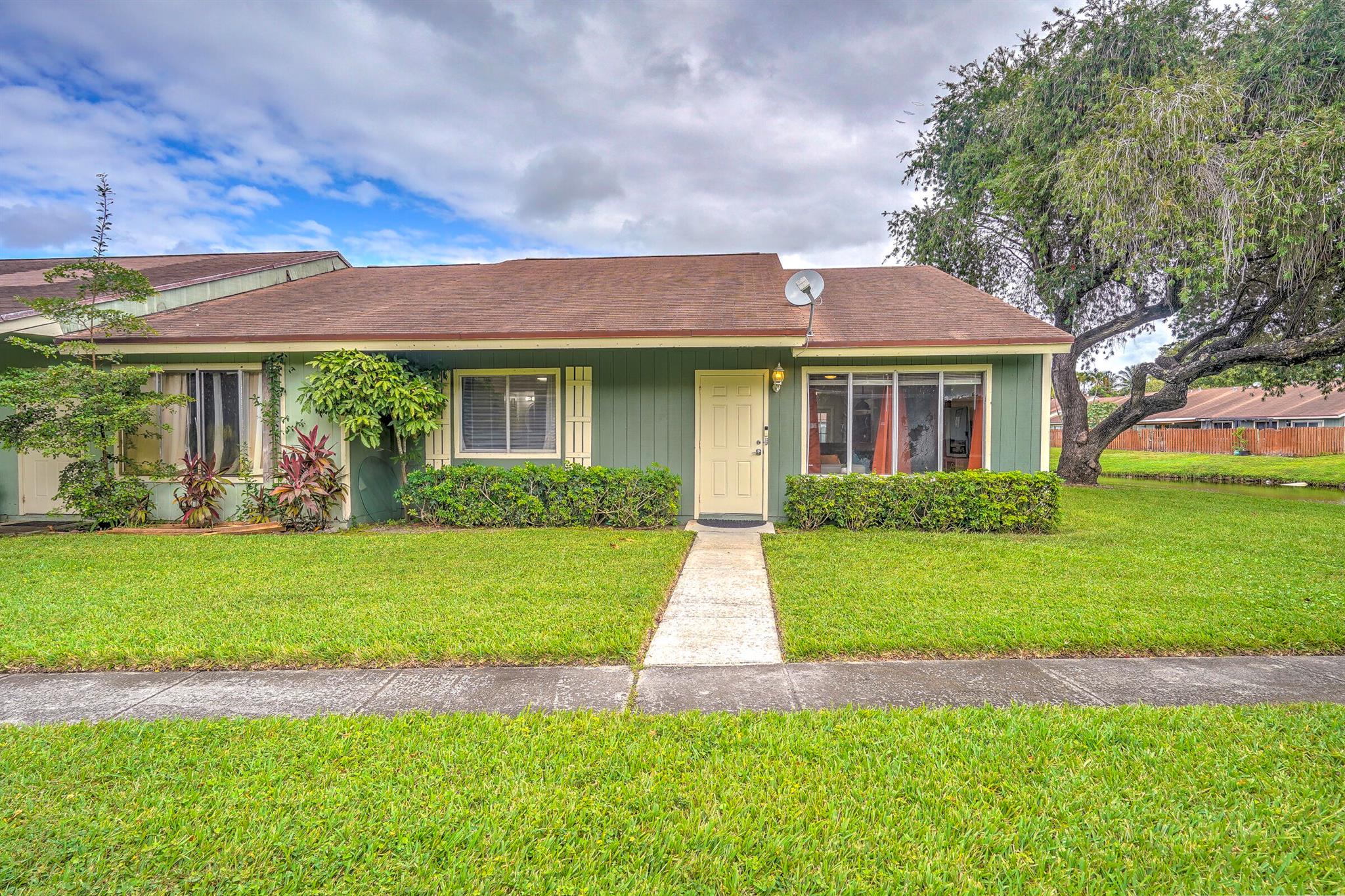 Welcome home to this completely renovated corner unit surrounded by beautiful lake views! Enjoy all the completed upgrades in a spacious, open kitchen with stainless steel appliances, modern celling fans, newer water heater, and some Hurricane Impact Windows! The backyard is fully fenced and includes a paved area to relax, enjoy the Florida weather, and do some grilling. Talk about location- minutes away from Palm Beach International Airport, I95, downtown and major shopping.