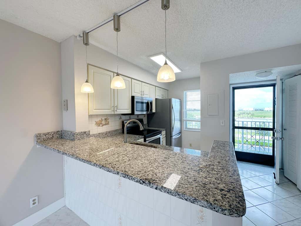 Photo of 2220 N CYPRESS BEND Drive #503, Pompano Beach, FL 33069 (MLS # B26064213)