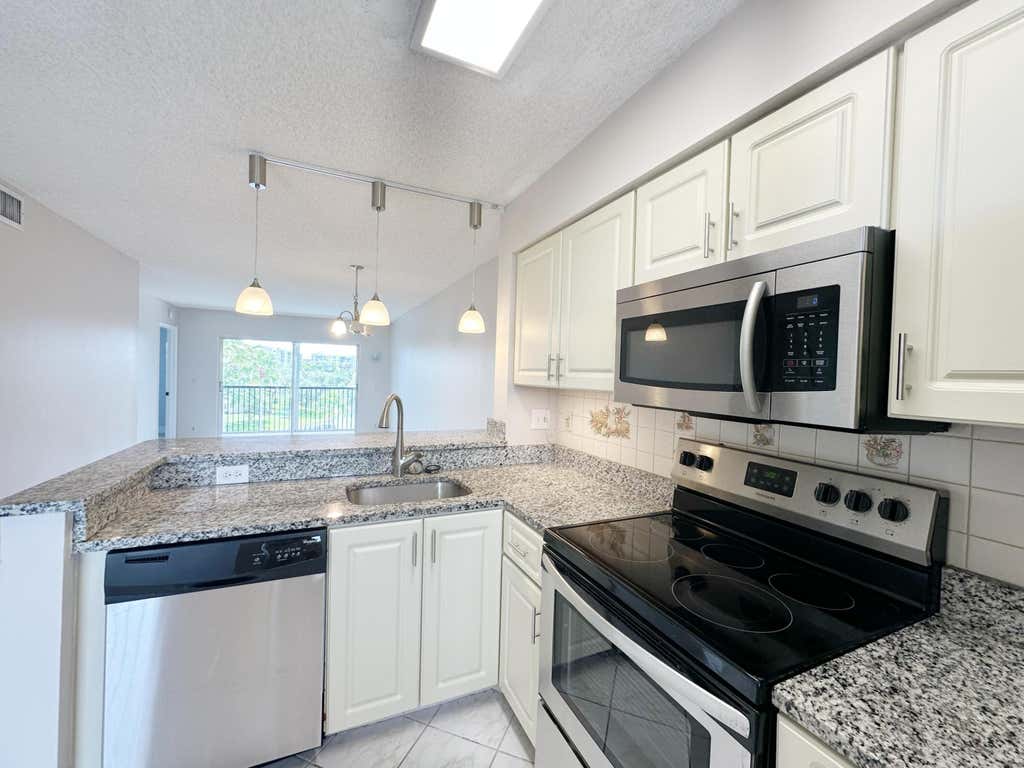 Photo of 2220 N CYPRESS BEND Drive #503, Pompano Beach, FL 33069 (MLS # B26064213)