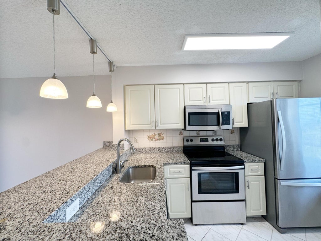 Photo of 2220 N CYPRESS BEND Drive #503, Pompano Beach, FL 33069 (MLS # B26064213)