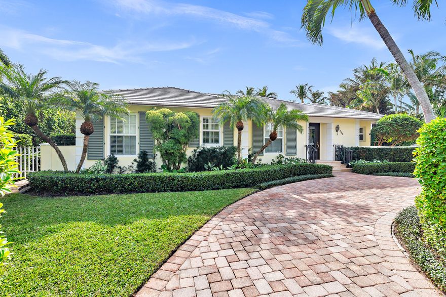 Stunning 4-bedroom plus office, 5.5-bathroom home near the desirable North End of Palm Beach. The downstairs primary and guest suites open to the pool and lush tropical gardens, offering a tranquil, resort-style living experience. This gracious two-story classic home also features two guest suites above the garage. Enjoy sunset walks on the nearby Lake Trail.
