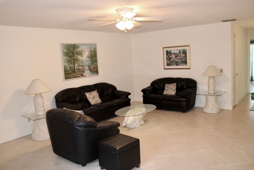 This beautifully maintained two-bedroom corner unit features modern upgrades completed within the past five years, blending style and convenience. Elegant 20x20 diamond-pattern tile flooring runs throughout, creating a cohesive look. The updated kitchen includes newer cabinetry, stainless-steel appliances, and a functional layout ideal for daily living and entertaining. As a corner unit, it offers added privacy and abundant natural light with peaceful landscape views. The nearby laundry room provides easy access without disrupting the living space. With its smart layout and prime location, this home offers comfort, style, and privacy.