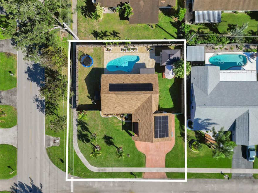This fully renovated pool home features complete energy-efficient recessed LED lighting, and porcelain tiles in the living areas, laminate wood planks in the beds, remodeled with modern flair and function. Kitchen boasts ceiling-height, glossy-gray soft-close cabinets, stainless-steel appliances and range hood, and brilliant quartz countertops with waterfall design. The bedrooms feature custom closets, and waterproof laminate flooring. Step outside onto the extended stamped-concrete pool deck and cool down in the free form pool. The summer kitchen and outdoor dining area on the wood deck is perfect for entertaining guests or private enjoyment alike. The 2-year new roof has solar panels which minimizes electrical costs, making the home much more energy efficient.