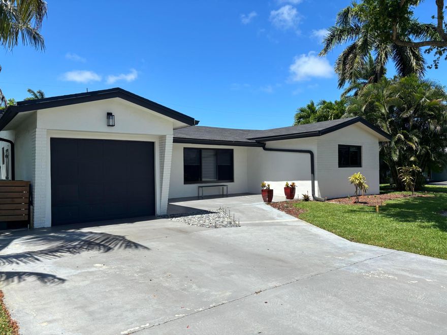 Welcome to this beautifully updated single family home in the heart of Coral Heights.  Packed with recent improvements which include a new roof, Kitchen, Impact Windows and Baths in 2024.  A/C New in 2025. Cast Iron Pipes Replaced in 2025. Sunroom overlooks the Patio and Inground Pool. Gas Hot water.  Private Landscaped Pool area .  Kitchen offers an open floor plan to the living area, breakfast Island, Updated Stainless appliances, a walk in Pantry and Laundry area.