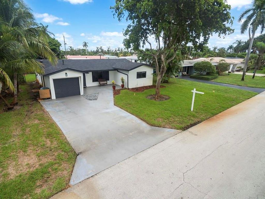 Photo of 1411 NE 41st Street, Oakland Park, FL 33334 (MLS # B26021672)