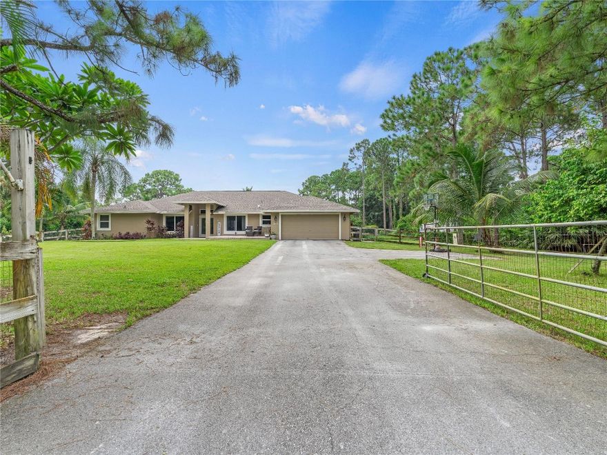 *Income Opportunity* Equestrian’s Dream Property! TWO LOTS spanning across almost 3 acres of pristine property just minutes to the horseshow. CBS airy center aisle barn with 6 12x12 stalls with individual fans and windows with "smart" wiring system and tack & feed rooms, 150’X120’ professionally built irrigated and lit sand ring with drainage base, 3 paddocks w/ room for more. Trailer entrance at back of property & another driveway for hay, feed, etc. separate from main drive to house. 2000 CBS, 4 bed / 3 bath main house with additional office. Upgrades include complete impact glass, roof 2021, 2 new A/Cs in 2022, pool & spa heater 2024, LVP flooring throughout. So many more upgrades you must see for yourself. Bring the family, bring the horses and get ready to enjoy.