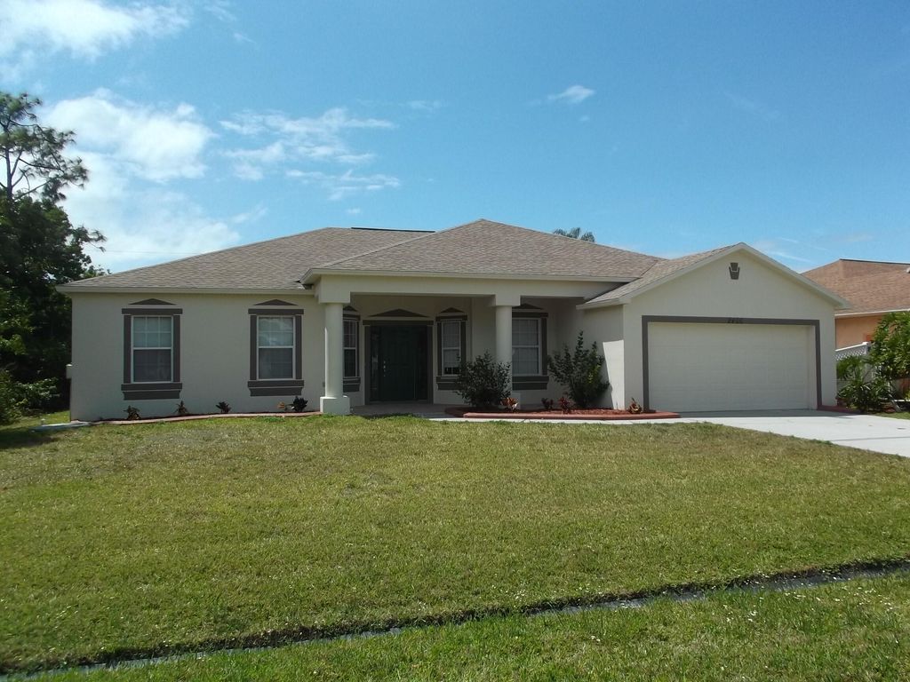 Photo of 2466 SW Mercer Street, Port Saint Lucie, FL 34984 (MLS # R10817160)