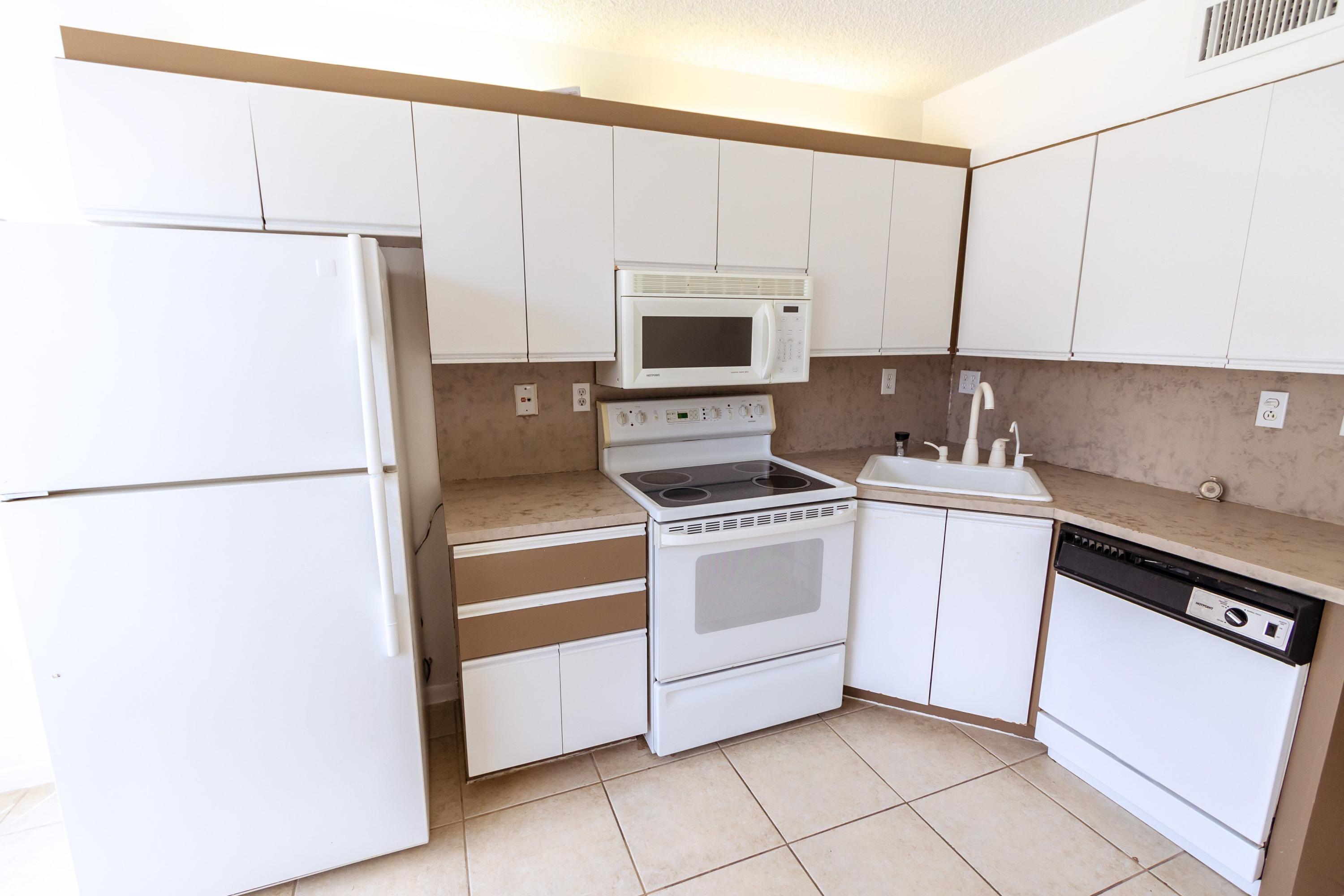 NEW CARPET IN BEDROOMS AND ALL ROOM HAVE JUST BEEN PAINTED. Second floor unit with screened balcony overlooking yard. All ages and small pet welcome. Enclosed laundry room with washer and dryer. Secure lobby and elevator in building. Split floor plan with bedroom, bath and walk-in closet on each side of the unit. Gated community. Pool, tennis, basketball court and meeting room. Close to shopping, downtown Delray and the BEACH. Small gated community with 4 buildings. Each building has its own board of directors.