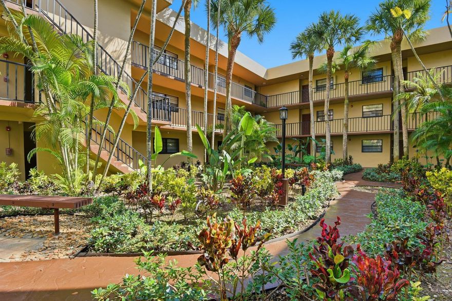 Home has been virtually staged. MOVE-IN READY! This charming 2-bedroom, 2-bath condo offers an open layout with a kitchen that overlooks the living room, featuring stainless steel appliances, white cabinetry, and a private balcony. Enjoy NEW updates throughout, including a new dishwasher and fresh interior paint. Each bedroom includes its own bathroom for added privacy. Community amenities feature tennis courts and a sparkling pool! One or more photos are virtually staged.