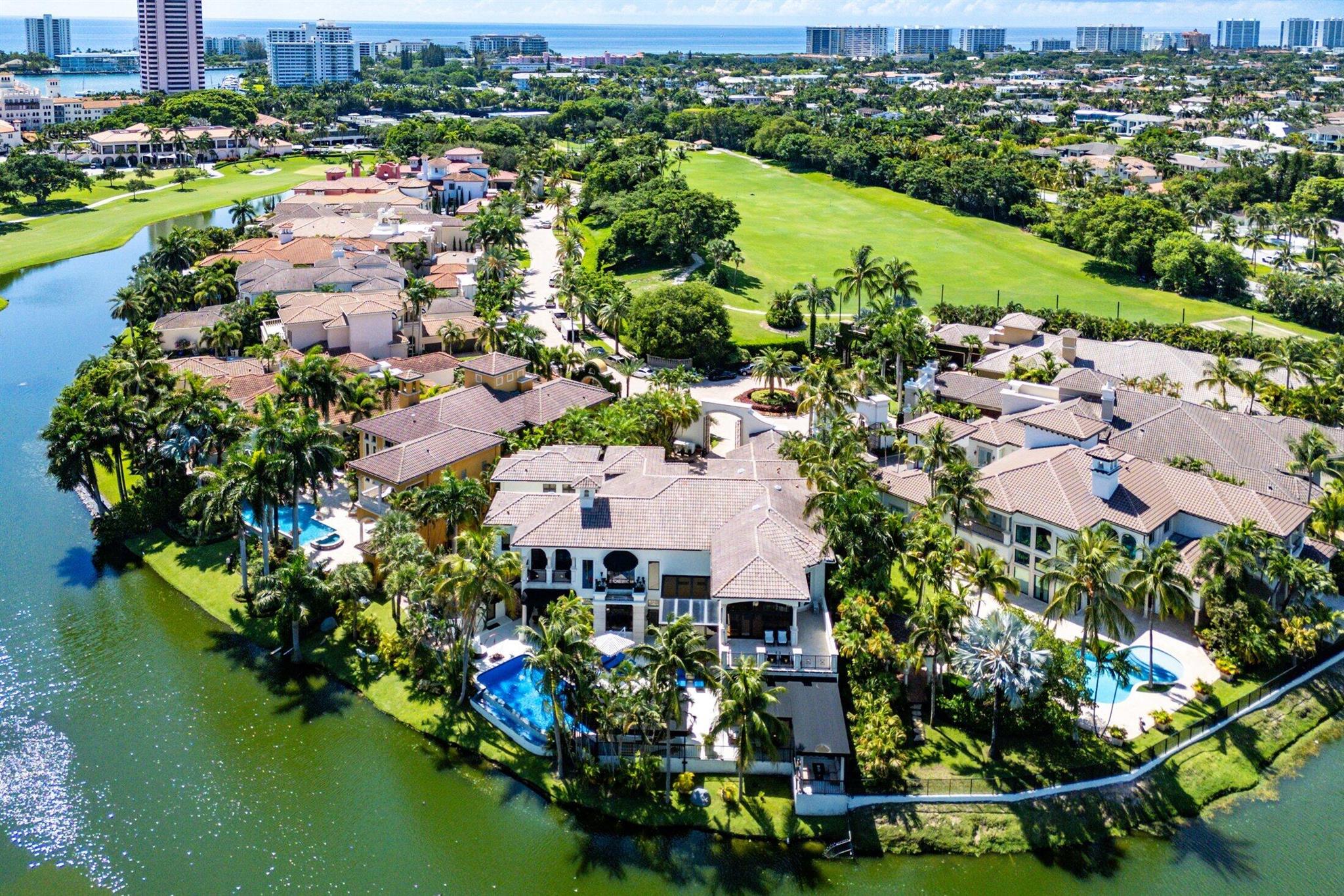 A Masterpiece Within the Iconic Grounds of The Boca Raton. Set behind the gates of the ultra-exclusive Mizner Lake Estates, nestled within the iconic grounds of The Boca Raton Hotel & Club, this extraordinary estate is a masterclass in timeless luxury and architectural sophistication. Encompassing 8,125 square feet under air and 11,285 total square feet, the residence enjoys commanding views of the sparkling lake and renowned championship golf course. Designed for effortless entertaining and refined everyday living, the resort-style outdoor retreat centers around an infinity-edge, sun-drenched pool with a sunken bar and in-water stools. The expansive summer kitchen features a 50-foot bar, built-in grill, and commercial-grade ice maker, ideal for hosting on any scale.
