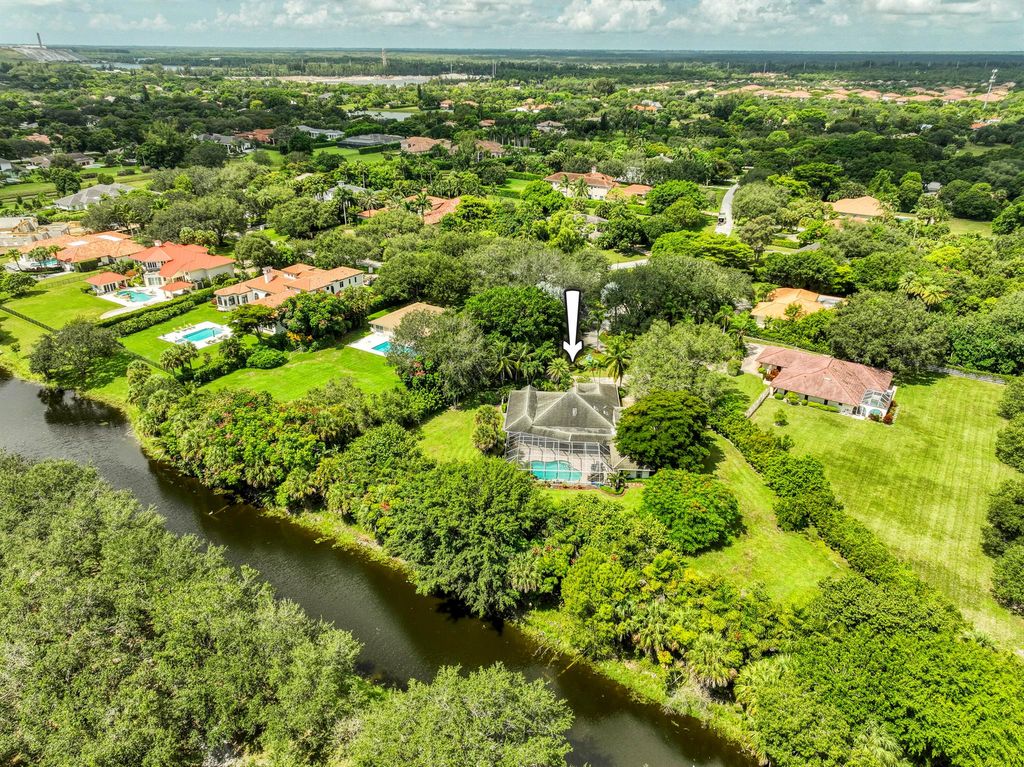 Photo of 5631 Whirlaway Road, Palm Beach Gardens, FL 33418 (MLS # R11118568)