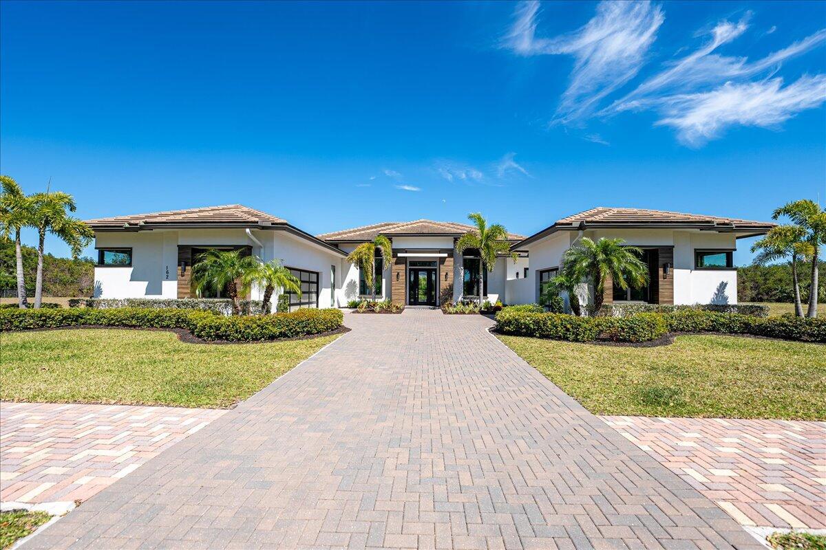 Discover Contemporary Elegance at its Finest in this Immaculate 4BR 4.5BA Custom Modern Gem! Located on The Private, Gated Island of Rivella, this Pool home, sitting on an Over-sized Lot, features a Chef's kitchen with Double Islands, Waterfall Quartz Counters, Stainless Steel Appliances including Gas Range. This Open Concept has plenty of Natural Light With all Bedrooms boasting their own En Suite Bathrooms. This Layout is Great for Entertaining on a Large Covered Patio / Pool Area with Outdoor Kitchen. Enjoy Florida Breezes with Water all around you! An Absolute Must See!