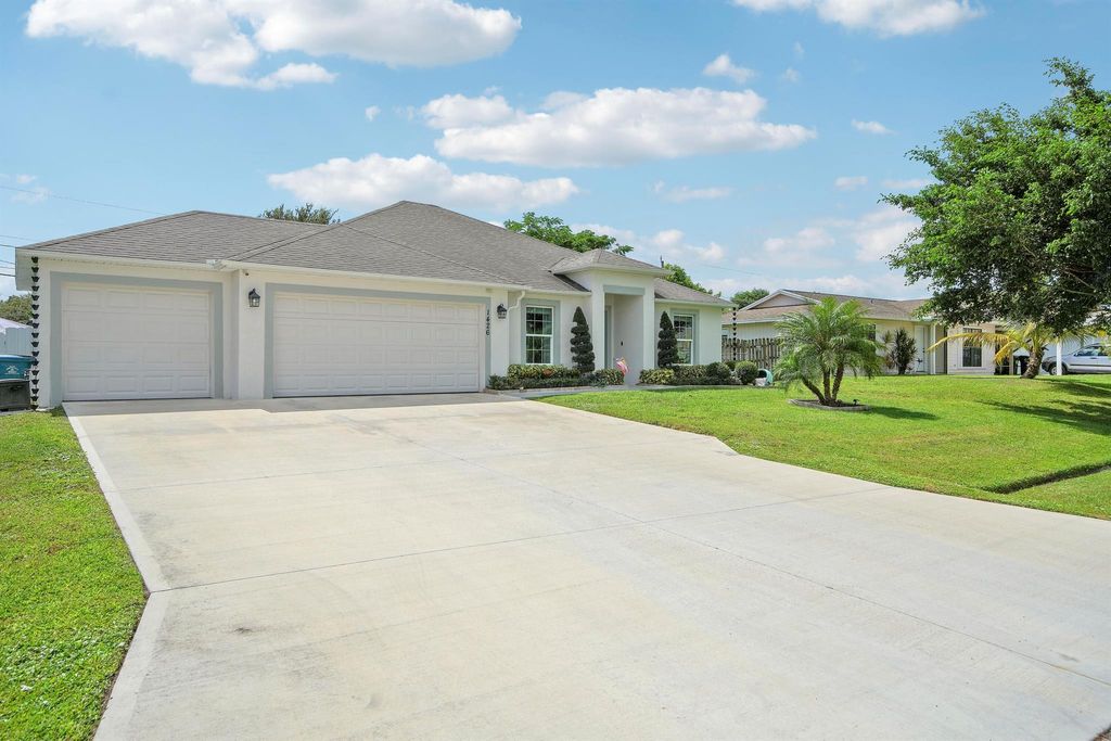 Photo of 1426 SW Devera Avenue, Port Saint Lucie, FL 34953 (MLS # R11126696)
