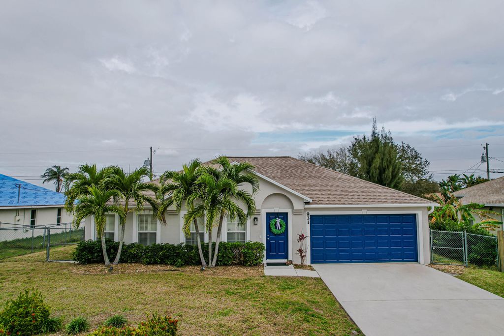 Photo of 931 SW Haas Avenue, Port Saint Lucie, FL 34953 (MLS # R10956398)