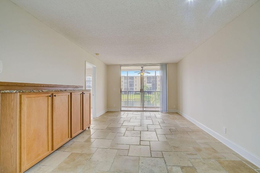 Pristine, renovated lakefront unit in Cascades of Lauderhill. Spacious 2BR/2BA 1st-floor residence w serene lake views, screened patio, & bright open layout. Features stone tile floors throughout, upgraded kitchen & baths, SS appliances, hurricane shutters on all windows, & in-unit full-size W/D. Primary suite offers ensuite bath & walk-in closet. Extra storage unit & elevator access included. Assigned parking + guest parking. Well-maintained, all-ages community w clubhouse, heated pool & spa w BBQ area, tennis courts, gym, sauna, billiards, jogging path & more. Building completed 30- & 40-yr structural/electrical inspections, has reserves, no special assessments, & new roof. HOA incl water & basic cable.