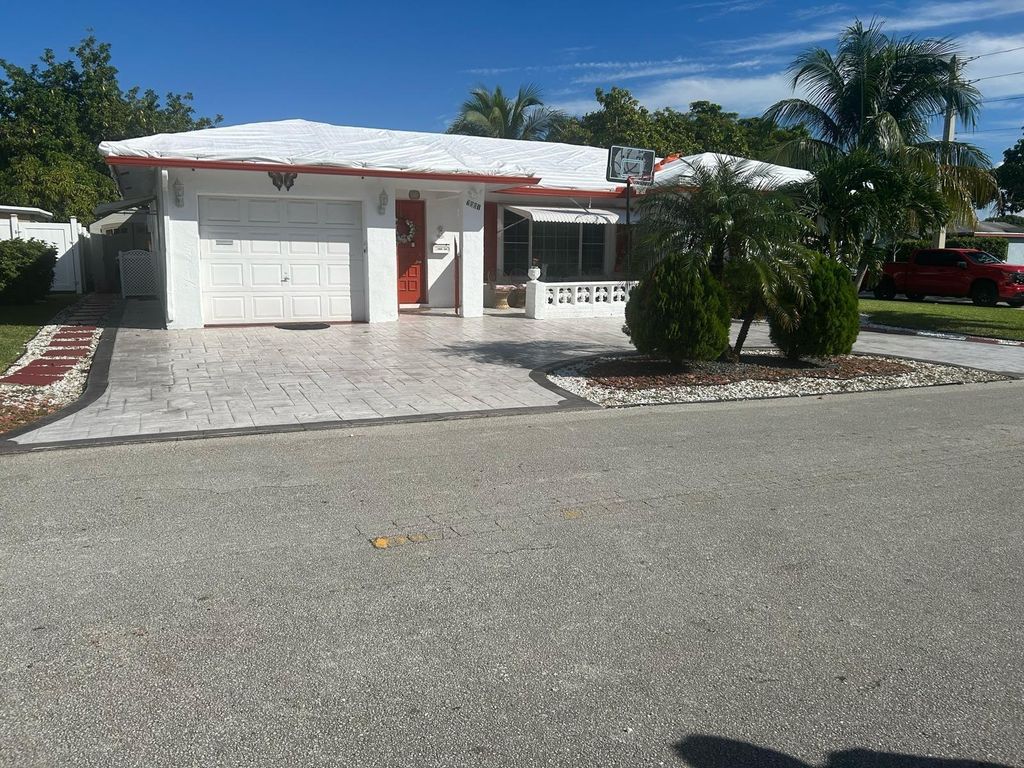 Photo of 7001 NW 76th Ct, Tamarac, FL 33321 (MLS # F10540437)