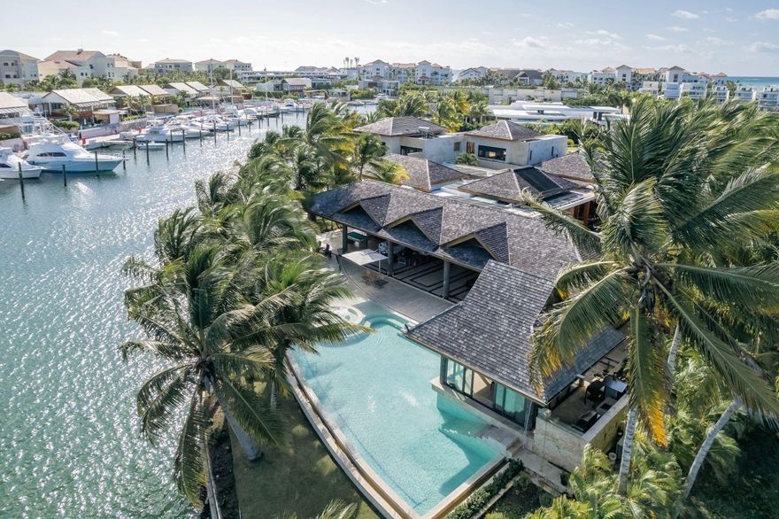Exclusive villa in Isla Grande, a private island in the Marina of Cap Cana, offering unparalleled privacy & breathtaking views. Bordering 328 linear ft of the main canal with direct ocean access. Built on 2 adjoining lots totaling 61,650 sf, the villa boasts 23,680 of covered living space plus extensive outdoor areas. 8 luxurious bedrooms with en-suite bathrooms. 4 VIP suites with private terraces, gardens, and personal jacuzzis.
2 TV lounges, wine cellar, private gym, sauna, massage room. A professional-grade hot kitchen & a cold kitchen.
A fully air-conditioned gazebo near the pool with a grill and wood-fired oven, plus a second garden gazebo with its own BBQ area. Marina Access. Private Dock accommodates a yacht over 120 feet & two auxiliary boats. Fully furnished excluding artwork.