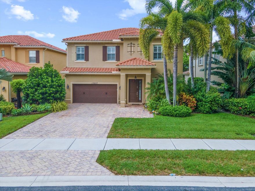 This is a charming home with lots of natural light, spacious rooms and a grand family area for TV watching, eating, etc. The high ceilings and planation shutters give it a distinguished feel. The solid CBS construction and full hurricane impact glass protects from the sounds and elements of outside. The backyard has a large covered patio and outdoor kitchen which is an ideal place for entertaining. This is an upgraded move-in ready home that will exceed your expectations! All in a perfectly situated gated community - HOA includes monitored ADT, clubhouse, pool, gym, tennis, playground, lawn, garden & irrigation service.