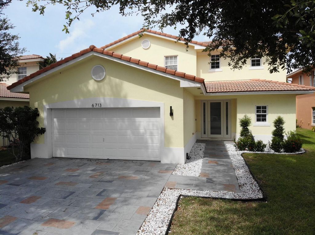 Photo of 6713 Eagle Ridge Drive, Greenacres, FL 33413 (MLS # R10917845)