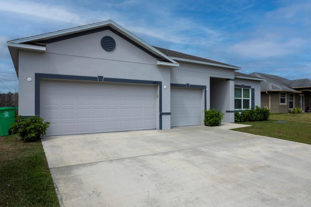 Photo of 4002 SW Bamberg Street, Port Saint Lucie, FL 34953 (MLS # R10970166)