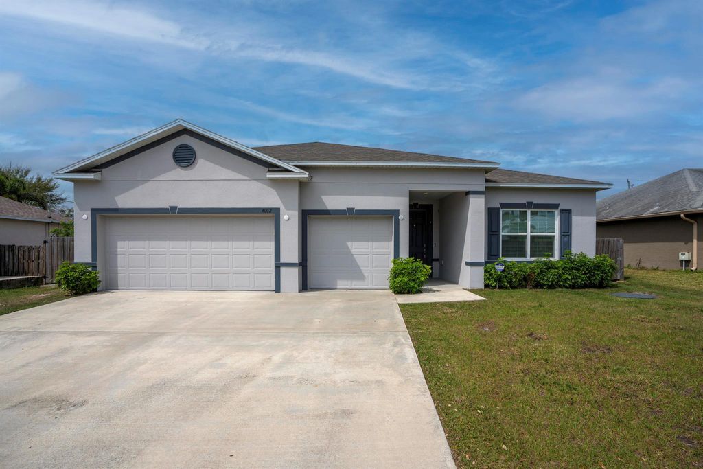 Photo of 4002 SW Bamberg Street, Port Saint Lucie, FL 34953 (MLS # R10970166)