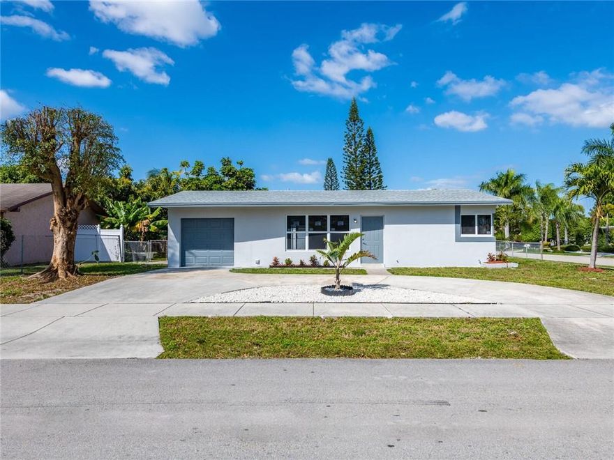 TOTALLY UPDATED/NEW ROOF/IMPACT WINDOWS/NEW LAMINATE FLOORS/NEW BATHROOMS/NEW KITCHEN WITH QUARTZ COUNTERTOPS AND STAINLESS APPLIANCES/PRIVATE POOL AREA/FENCED CORNER LOT/CIRCULAR DRIVEWAY/CLOSE TO THE BEACH/HIGHWAYS/HOSPITALS/SHOPPING/RESTAURANTS/