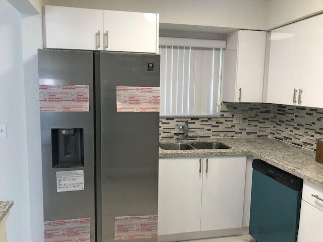 Photo of 1104 RIVERSIDE Drive, Greenacres, FL 33463 (MLS # B26073212)