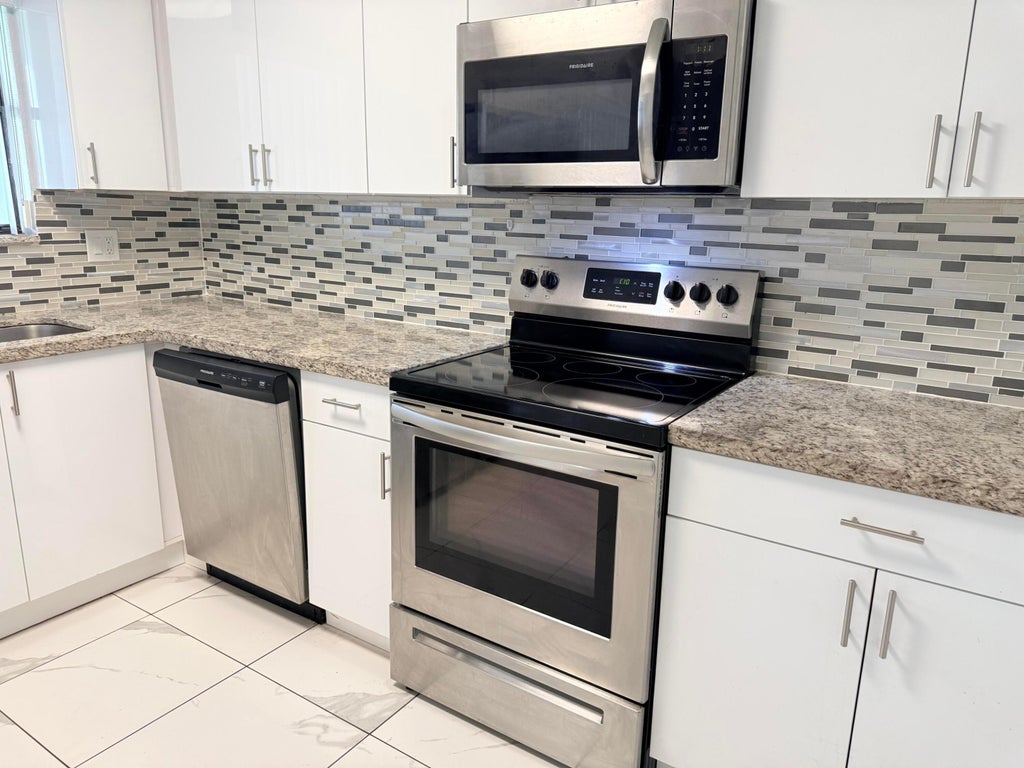 Photo of 1104 RIVERSIDE Drive, Greenacres, FL 33463 (MLS # B26073212)