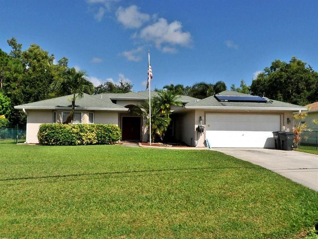 Photo of 5028 NW Flintstone Avenue, Port Saint Lucie, FL 34983 (MLS # R10730553)