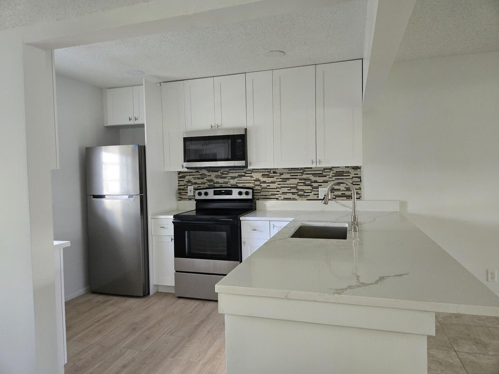 Photo of 2700 CASITA Way #2140, Delray Beach, FL 33445 (MLS # B26072078)