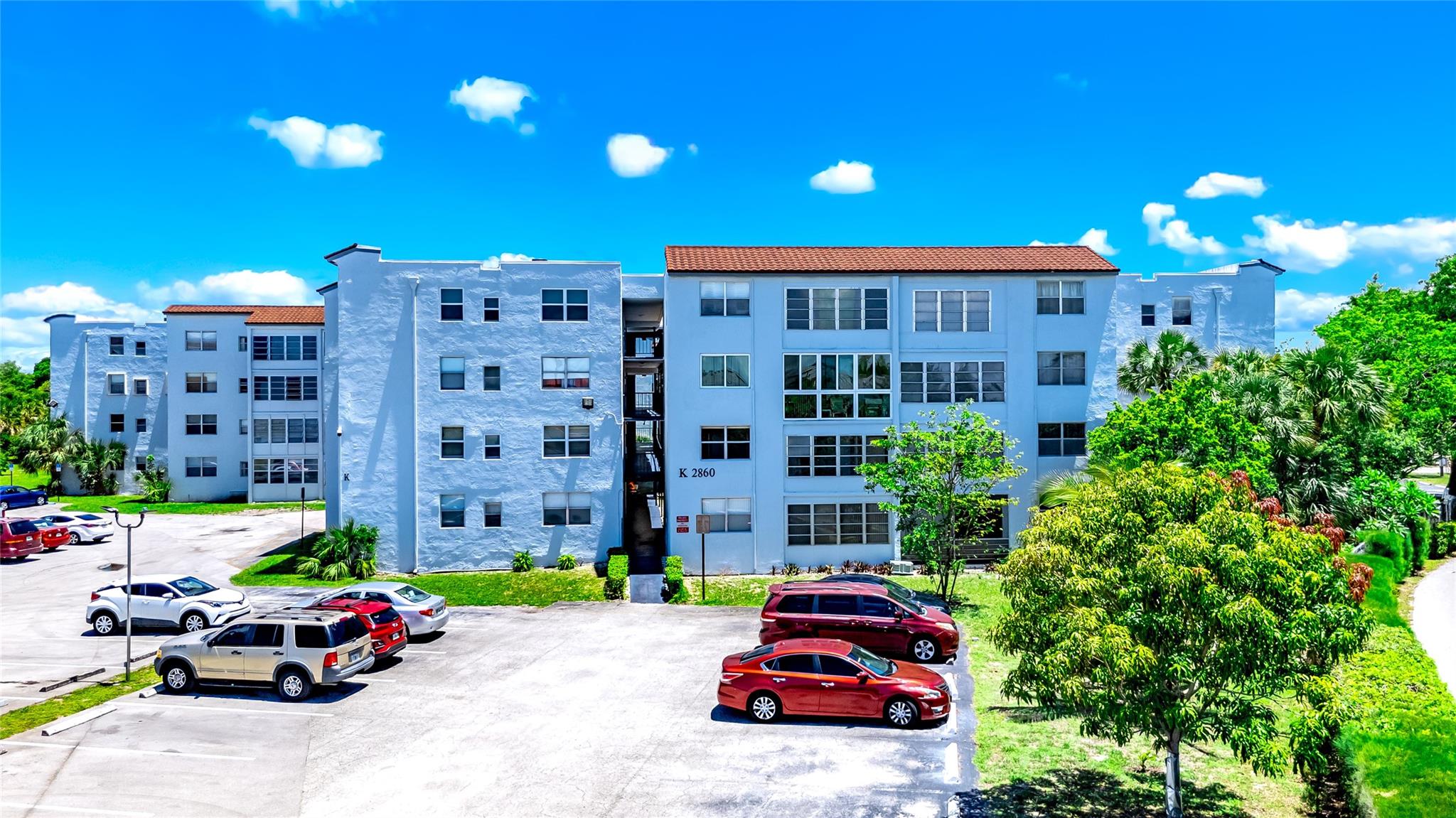 Beautifully maintained top floor 2BR/2BA. Desirable corner unit that supplies additional natural lighting. Relaxing view of nature from your Living room and Balcony. inside Roomy Pantry and ample storage area. Steps away from the community laundry facility & additional storage. Gated community w/24-hr security. Amenities include; heated pool, clubhouse, billiards & shuffleboard. 580 credit score/10% down/1 owner must be 55+. Can rent after 2 years of ownership. Easy to Show !!