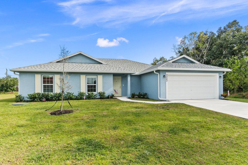 Photo of 2243 SE Rock Springs Drive, Port Saint Lucie, FL 34952 (MLS # R10966290)