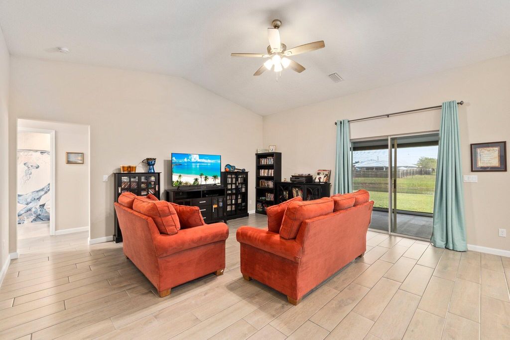 Photo of 2243 SE Rock Springs Drive, Port Saint Lucie, FL 34952 (MLS # R10966290)