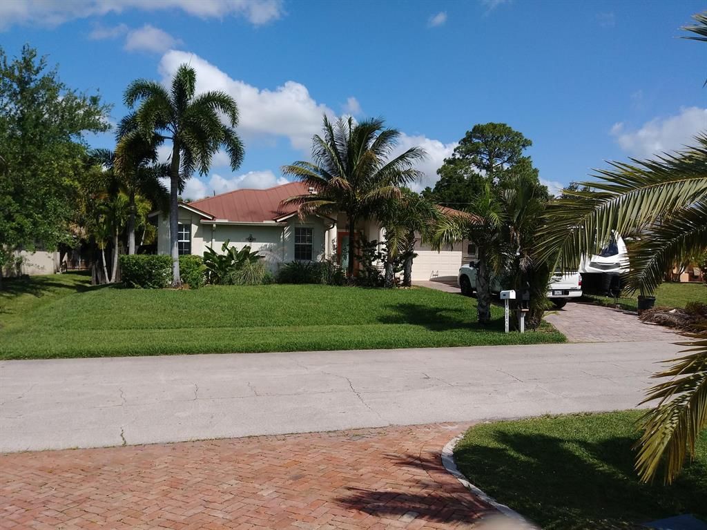 Photo of 1758 SW Columbia Street, Port Saint Lucie, FL 34987 (MLS # R10713723)