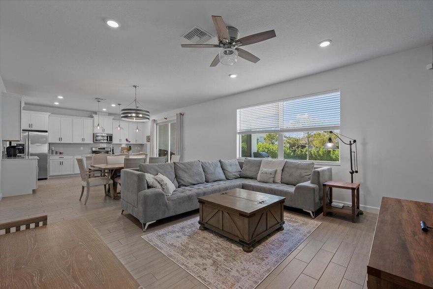 By far the BEST value in Arden!  Welcome home to your new spacious and thoughtfullly designed home in Arden, the only ''Agricommunity'' in Palm Beach County.  With 3 bedrooms and 2 bathrooms upstairs, and a full bedroom and bathroom downstairs, there is space for the entire family to enjoy the luxurious lifestyle Arden offers.  This home has all impact doors and windows,  fully fenced and hedged yard, a finished garage w/epoxy flooring, and an upgraded HVAC system with the ionization air cleansing system.  A few extras worth mentioning - ceiling fans in every room, upgraded master bathroom, two walk in closets in master, and blinds and/or curtains on every window, this home is ready for your family to move right in.