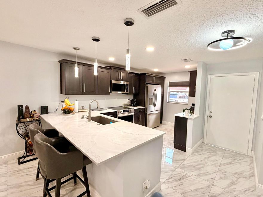 Completely updated 2bed/2bath first floor villa with a lake view. Very light and bright. Spacious primary bedroom and walk-in closet. Private washer and dryer inside the unit. New roof, new AC and newer tankless water heater. Separate extra storage unit. Located in an active 55+ guard-gated community. One resident must be 55 or older.  Rent includes: cable, water, lawn care, pest control, 24h guard gate, several pools, tennis, billiard, and so much more. Offered for annual rent.