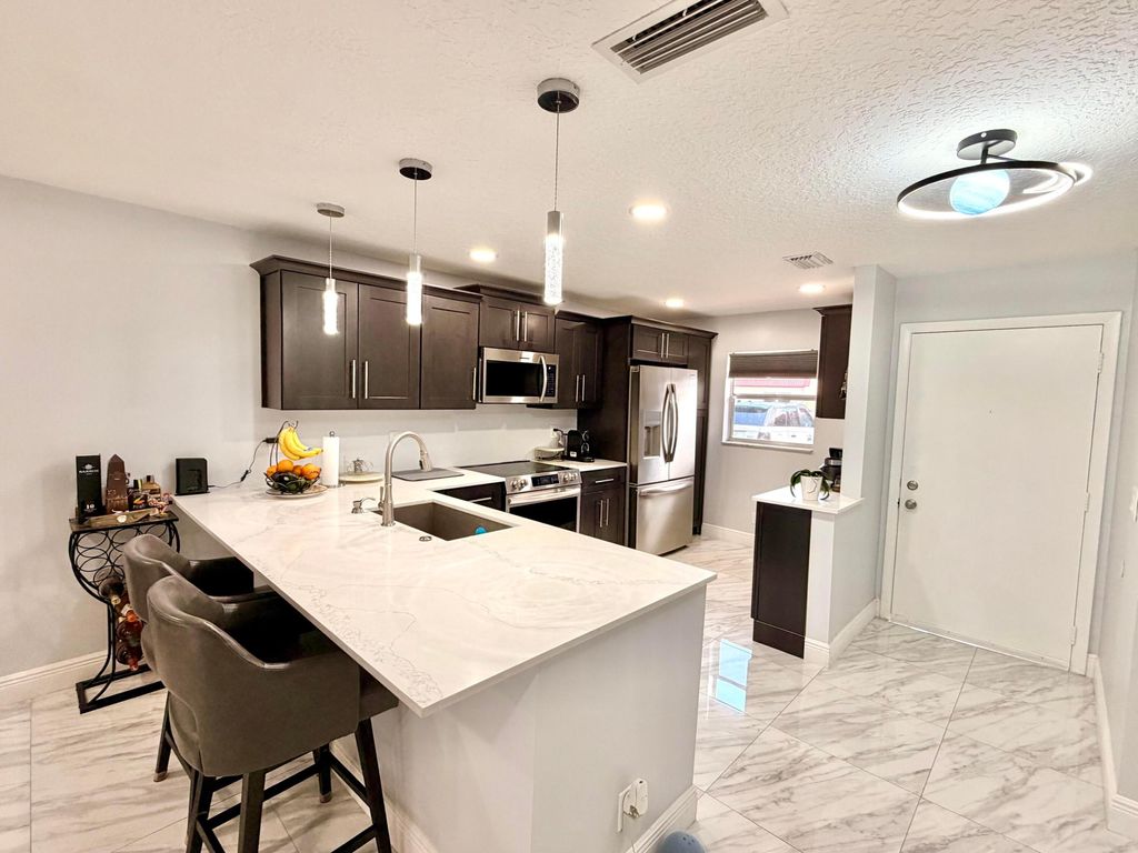 Photo of 201 Lake Dora Drive, West Palm Beach, FL 33411 (MLS # B26027392)