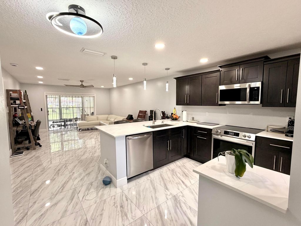 Photo of 201 Lake Dora Drive, West Palm Beach, FL 33411 (MLS # B26027392)