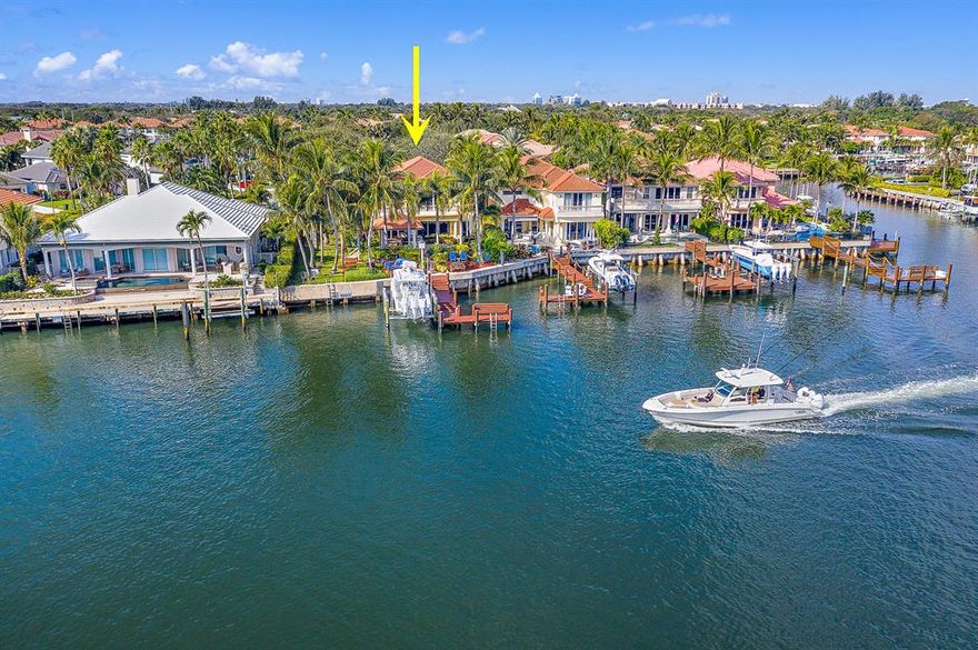 Beautifully renovated Hamilton model on direct Intracoastal in a No Wake zone with large backyard and a 20,000lb lift. The chef's kitchen features a large center island, Habersham cabinetry, SubZero refrigerator, Wolfe stove and a built-in Bosch Coffee/Expresso machine. Other upgrades include Turkish Marble floors and wood floors, all bathrooms redone, Custom Wine Room with 1,500 bottle capacity, Nano Wall doors upstairs and down, complete impact glass, custom moldings, solid wood interior doors, and a large covered loggia/summer kitchen with gas grill, Green Egg, refrigerator and icemaker.