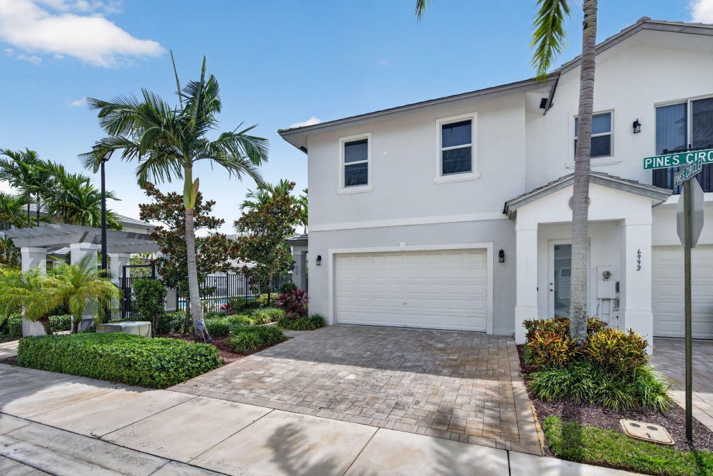 Photo of 6994 Pines Circle, Coconut Creek, FL 33073 (MLS # B26061293)
