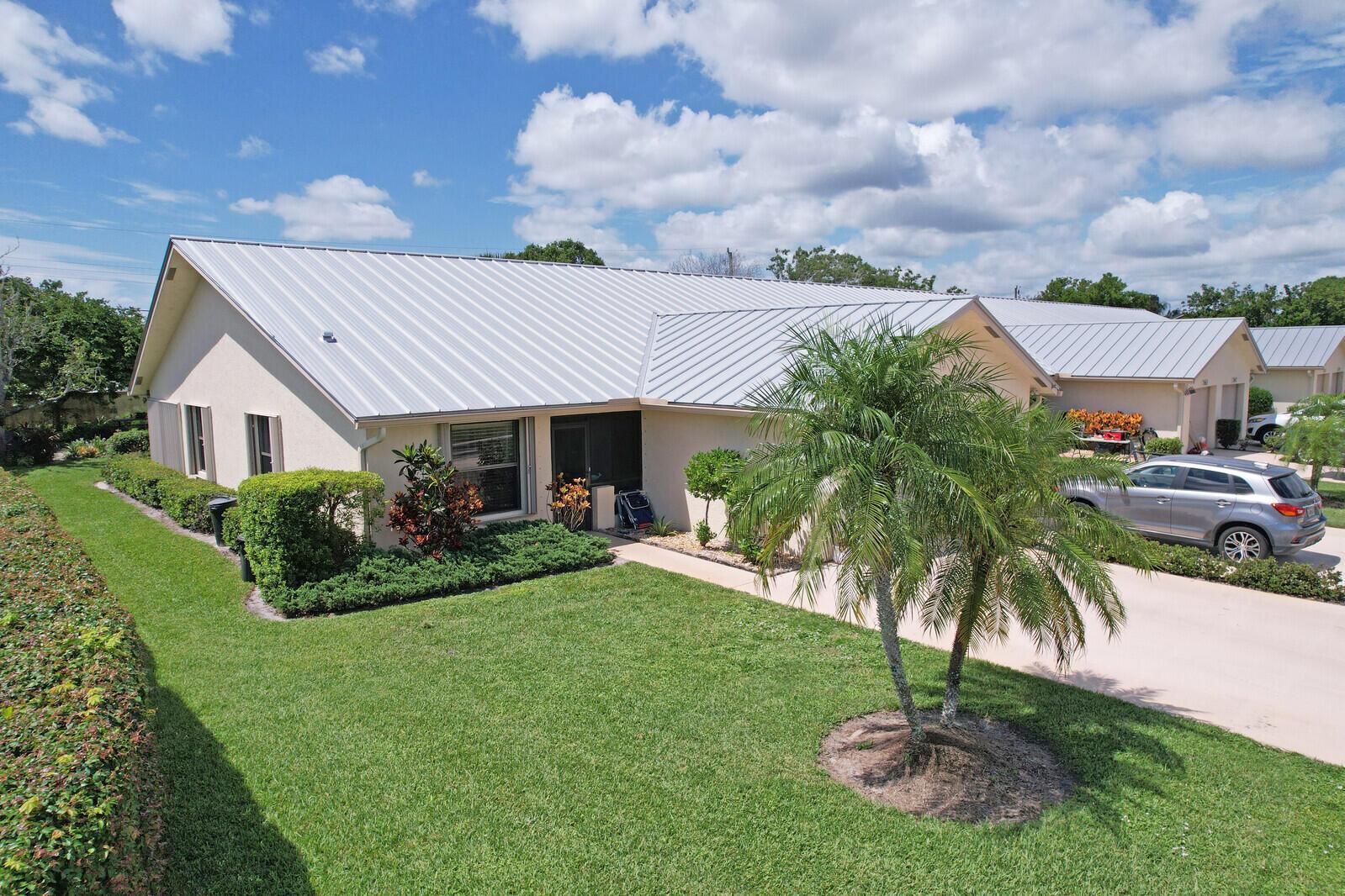 Must-see Pristine Corner-Unit Villa in charming Sugar Sands. This Immaculate 2-bedroom 2-bathroom villa offers tranquil living just a few miles from the beach. With an over-sized corner unit and additional private and quaint yard, this villa is uniquely special. It has been tastefully updated with a stunning kitchen, luxury vinyl flooring in both bedrooms, washer & dryer (all 2022) and new AC unit (2023). An active 55+ community in Hobe Sound offers numerous activities, community pool, clubhouse and boat/RV storage.