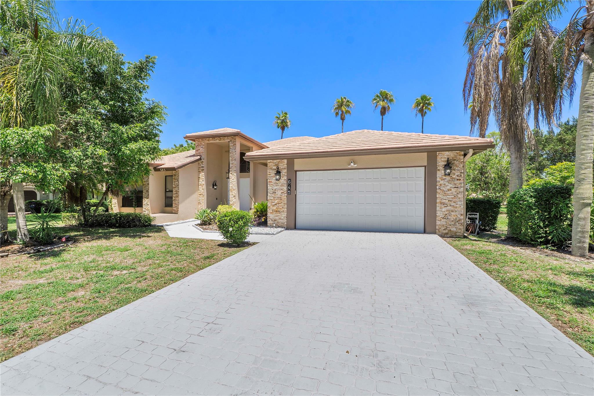 Pack your bags, this beautifully remodeled 4/3.5 pool home in highly sought-after Glenoaks is waiting for you! This freshly painted SMART home boasts a covered/screened-in patio/pool w/heated jetted spa, perfect for entertaining on warm Florida nights. Entryway greets you w/high volume ceilings & recessed lights, electric fireplace, updated eat-in kitchen w/wood cabinets, Quartz counters/island & SS appliances, remodeled guest bathroom w/dual sinks, laundry room w/brand new front loading machines. Spacious Master suite w/His & Her walk-in closet system, gorgeously updated bath w/dual sinks, step-in shower & separate soaking tub. Mature fenced yard. Impact windows & accordion shutters. Finished garage incl. floor, lights and built-ins.